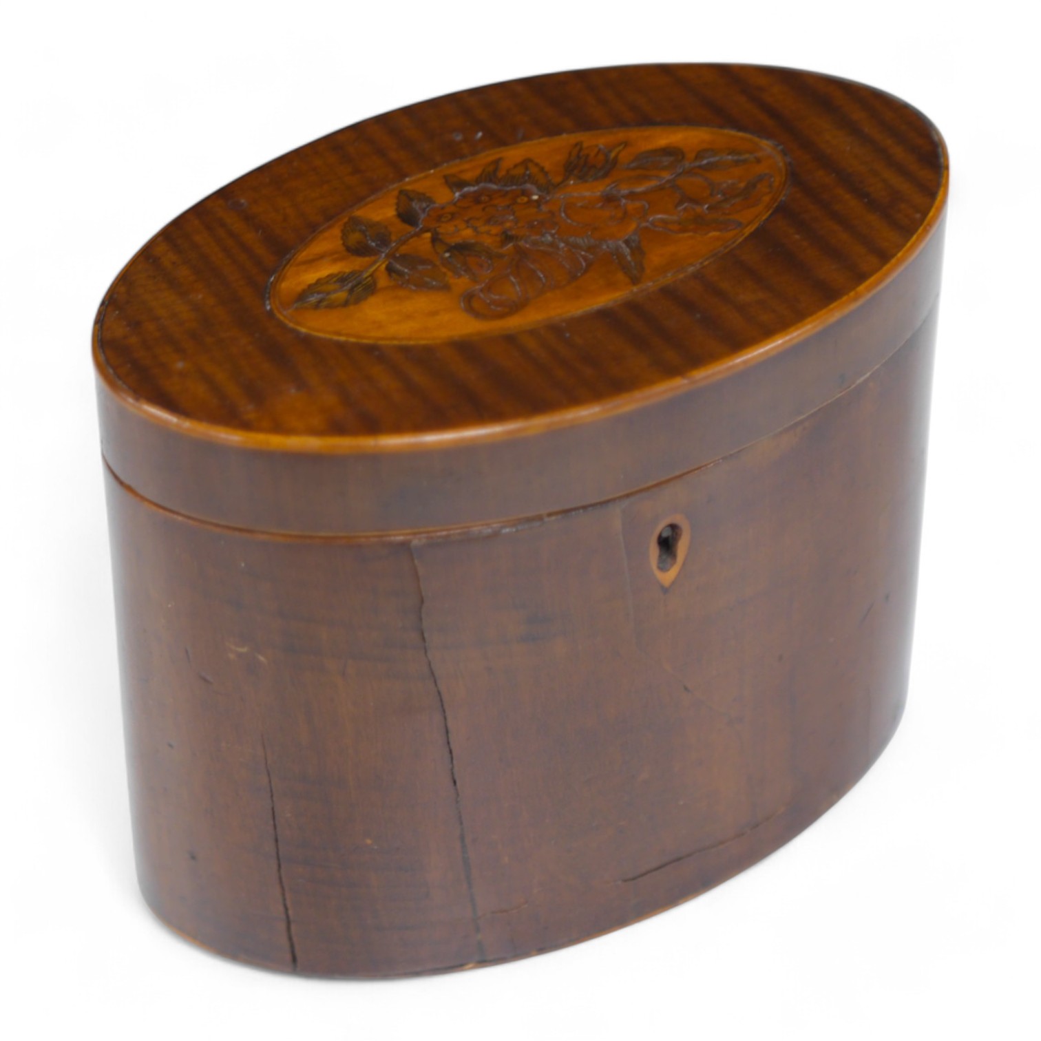 A George III oval inlaid sycamore tea caddy, 12cm high x 15cm wide. Condition - two splits to front.